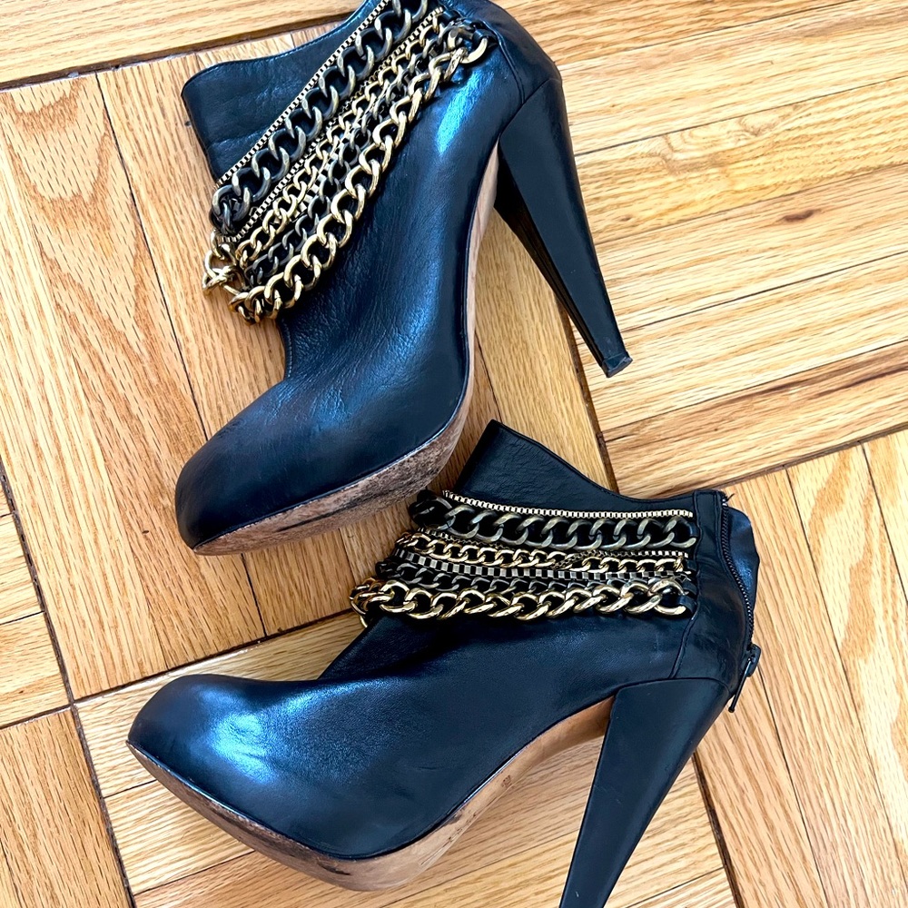 Black leather cascade chain ankle booties